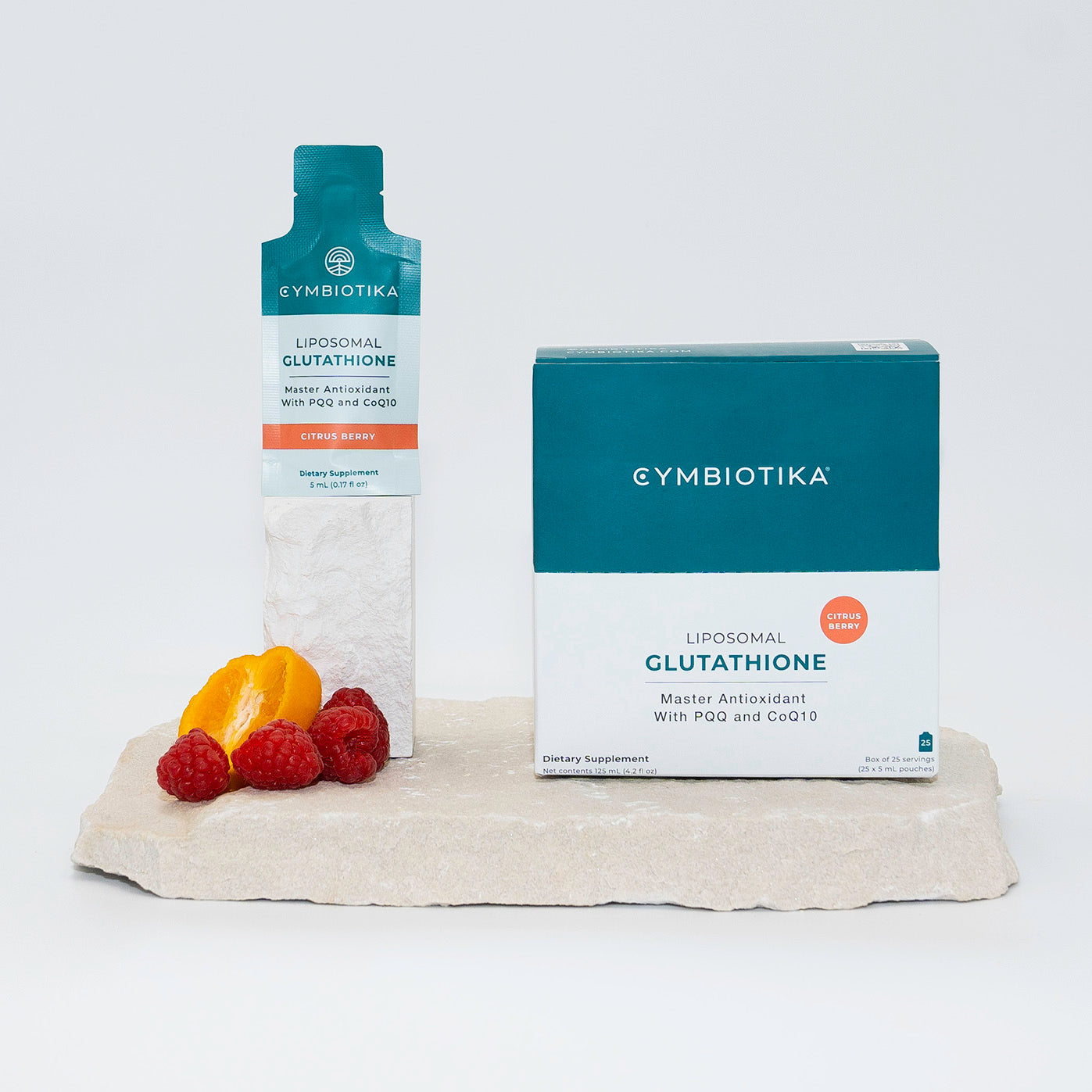 Liposomal Glutathione Box and Pouch on Stone with Orange and Raspberries 